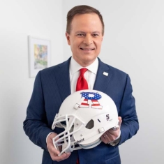 Mike Emanuel with Rutgers football helmet